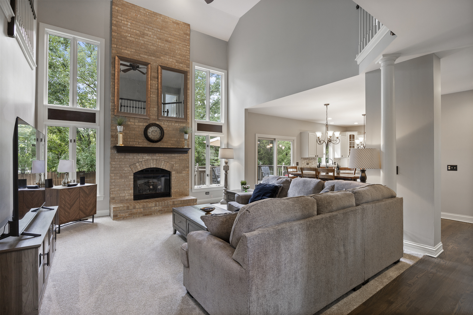 2177 Red Maple Lane Aurora, IL 60502 - Photo 9 of 40 a living room with furniture a large window and a fireplace