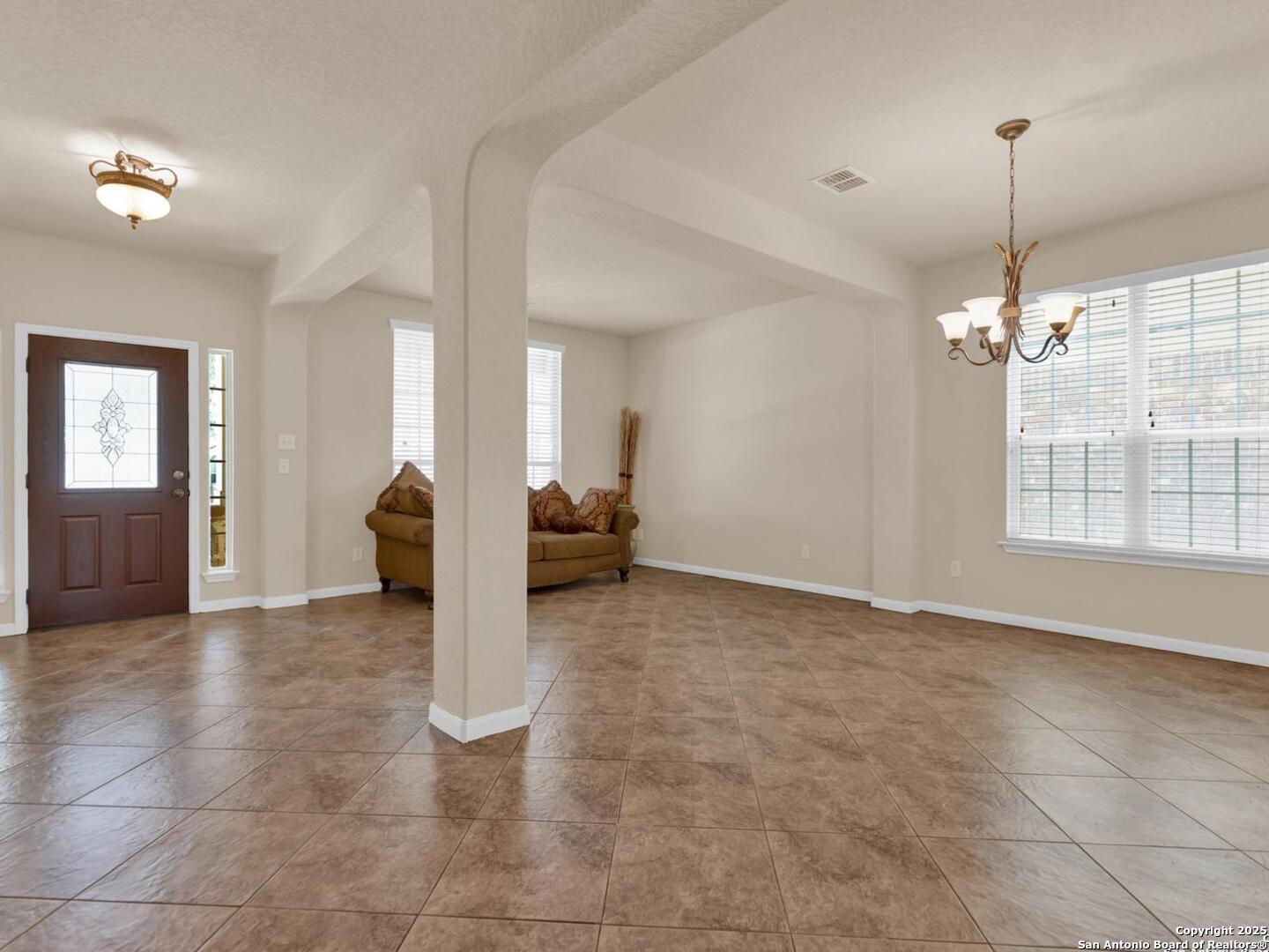 1008 Magellan Windcrest, TX 78239 - Photo 13 of 31 a view of an empty room with window and cabinet