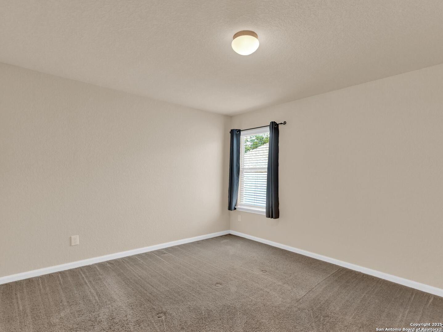 1008 Magellan Windcrest, TX 78239 - Photo 25 of 31 an empty room with windows