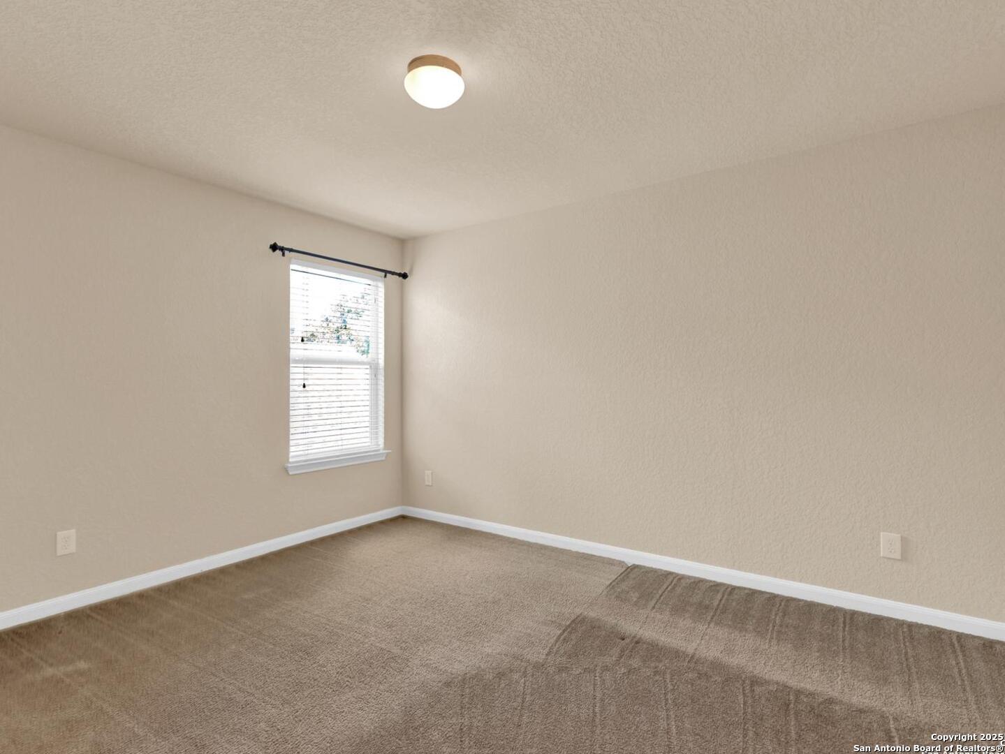 1008 Magellan Windcrest, TX 78239 - Photo 27 of 31 an empty room with a window