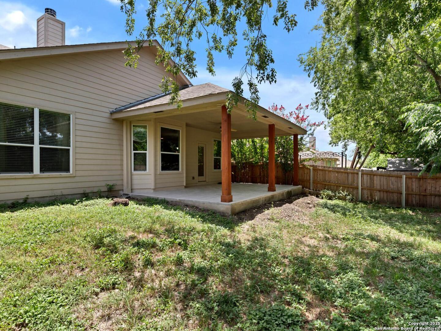 1008 Magellan Windcrest, TX 78239 - Photo 30 of 31 a backyard of a house with plants and tree