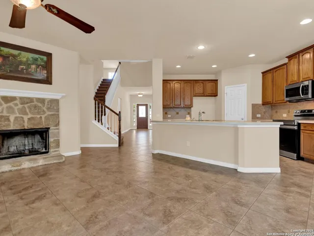 a kitchen that has a sink and a stove in it
