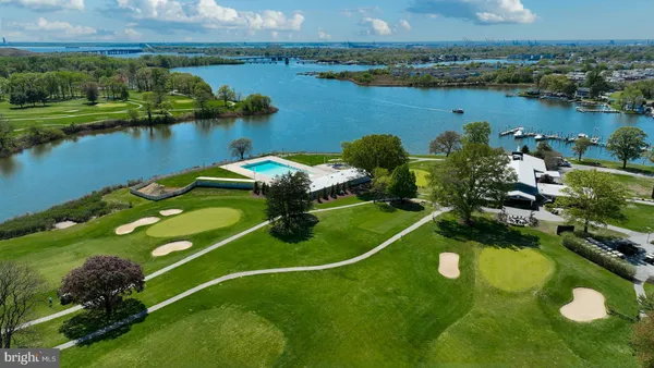 an aerial view of a house with a lake view