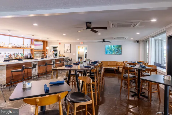a very nice looking kitchen with a dining table and chairs