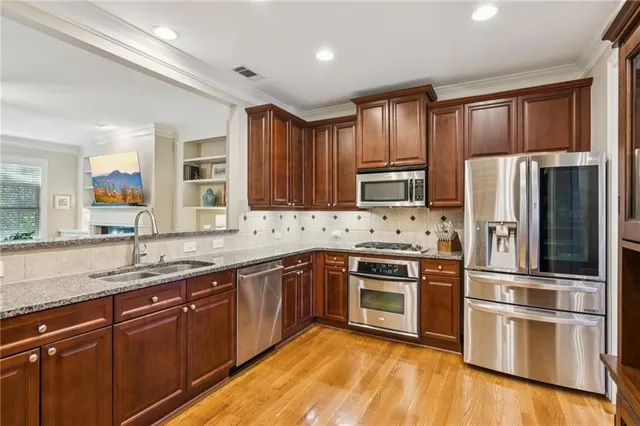 a view of a workspace with a window and a couch