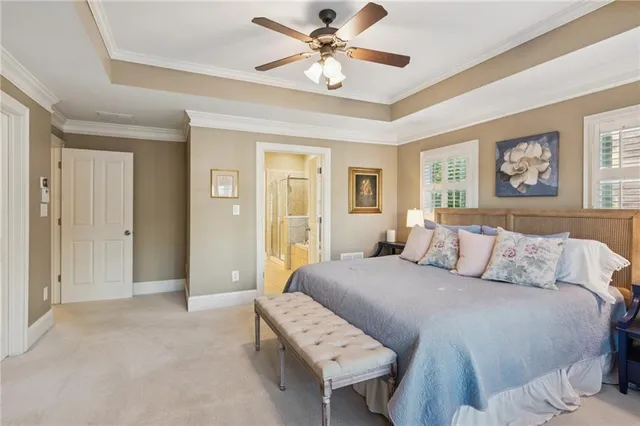 a bedroom with a bed and a book shelf