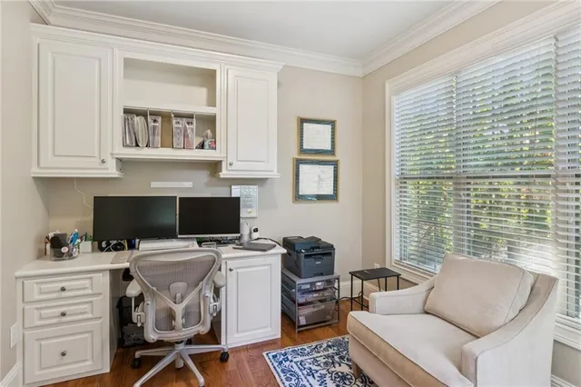 a view of a brick building next to a yard