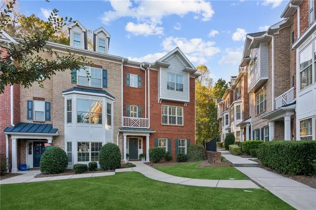 a view of a hallway with wooden floor and entryway