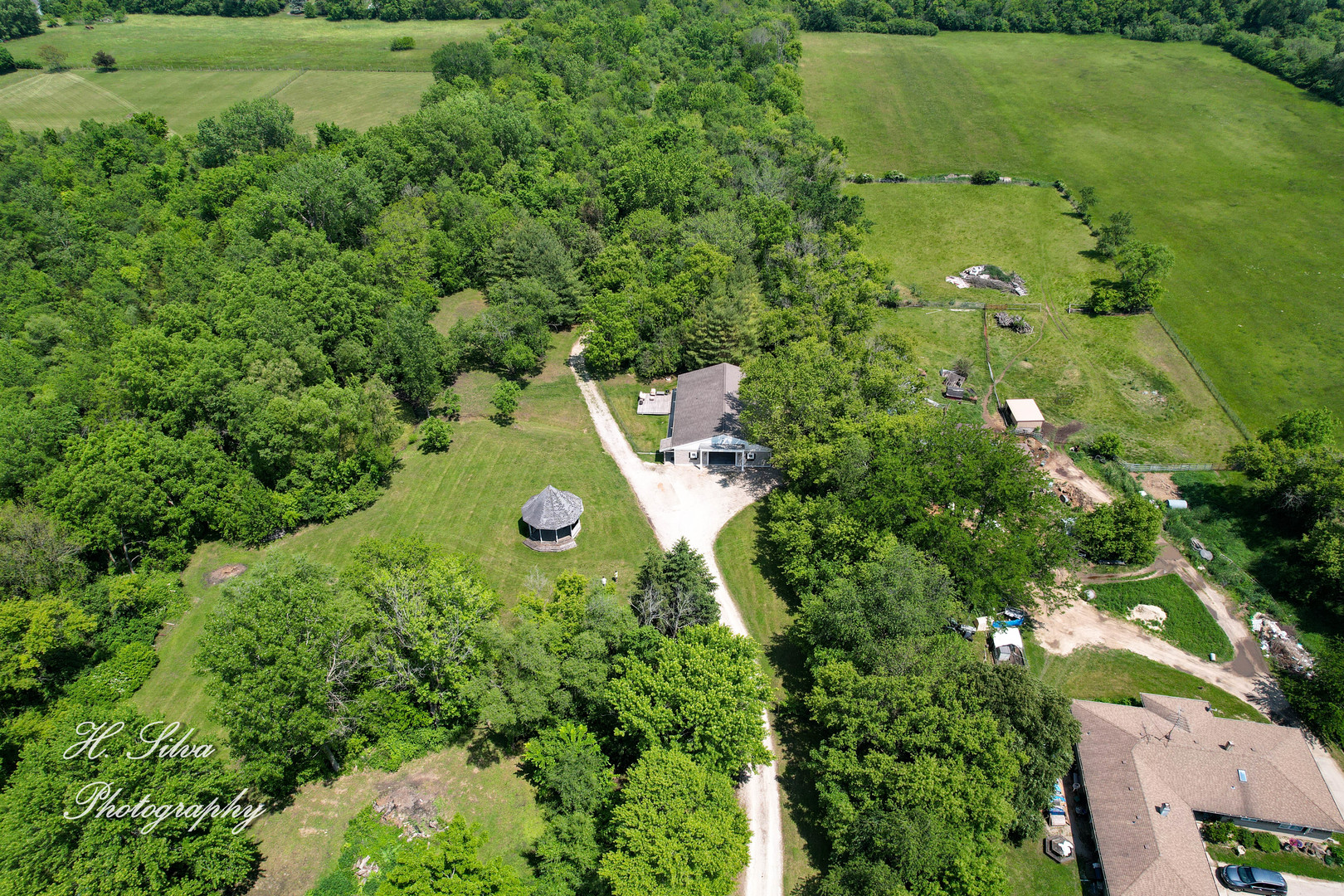 8106 Maple Street Marengo, IL 60152 - Photo 2 of 48 an aerial view of a house with a yard
