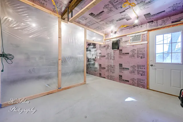 a view of a lake with couches and wooden floor