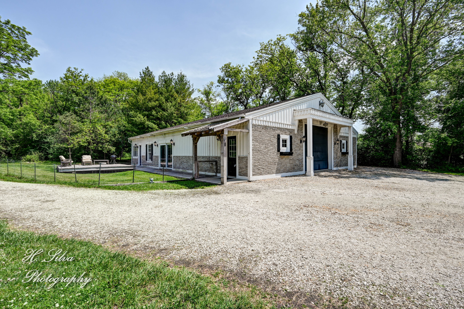 8106 Maple Street Marengo, IL 60152 - Photo 30 of 48 a view of a house with a backyard