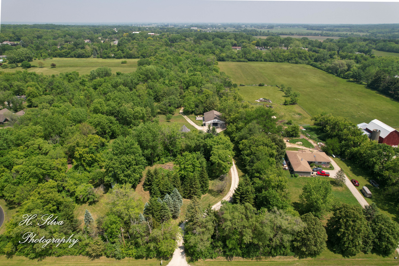8106 Maple Street Marengo, IL 60152 - Photo 32 of 48 an aerial view of a houses with a yard