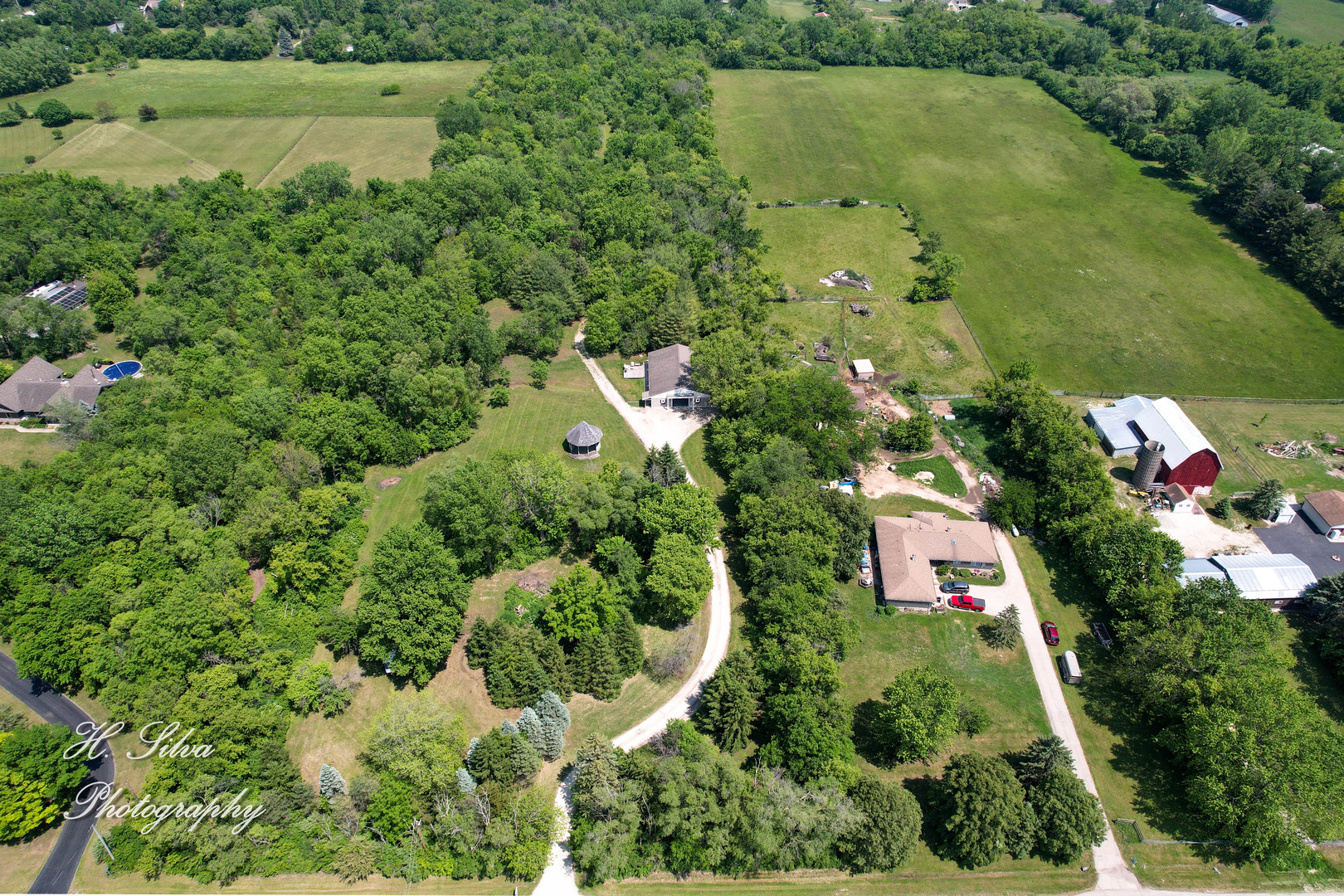 8106 Maple Street Marengo, IL 60152 - Photo 33 of 48 an aerial view of residential house with outdoor space and swimming pool