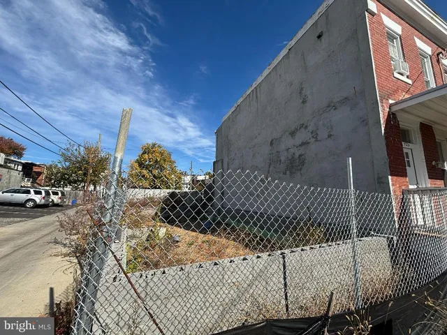 a view of yard with cars parked