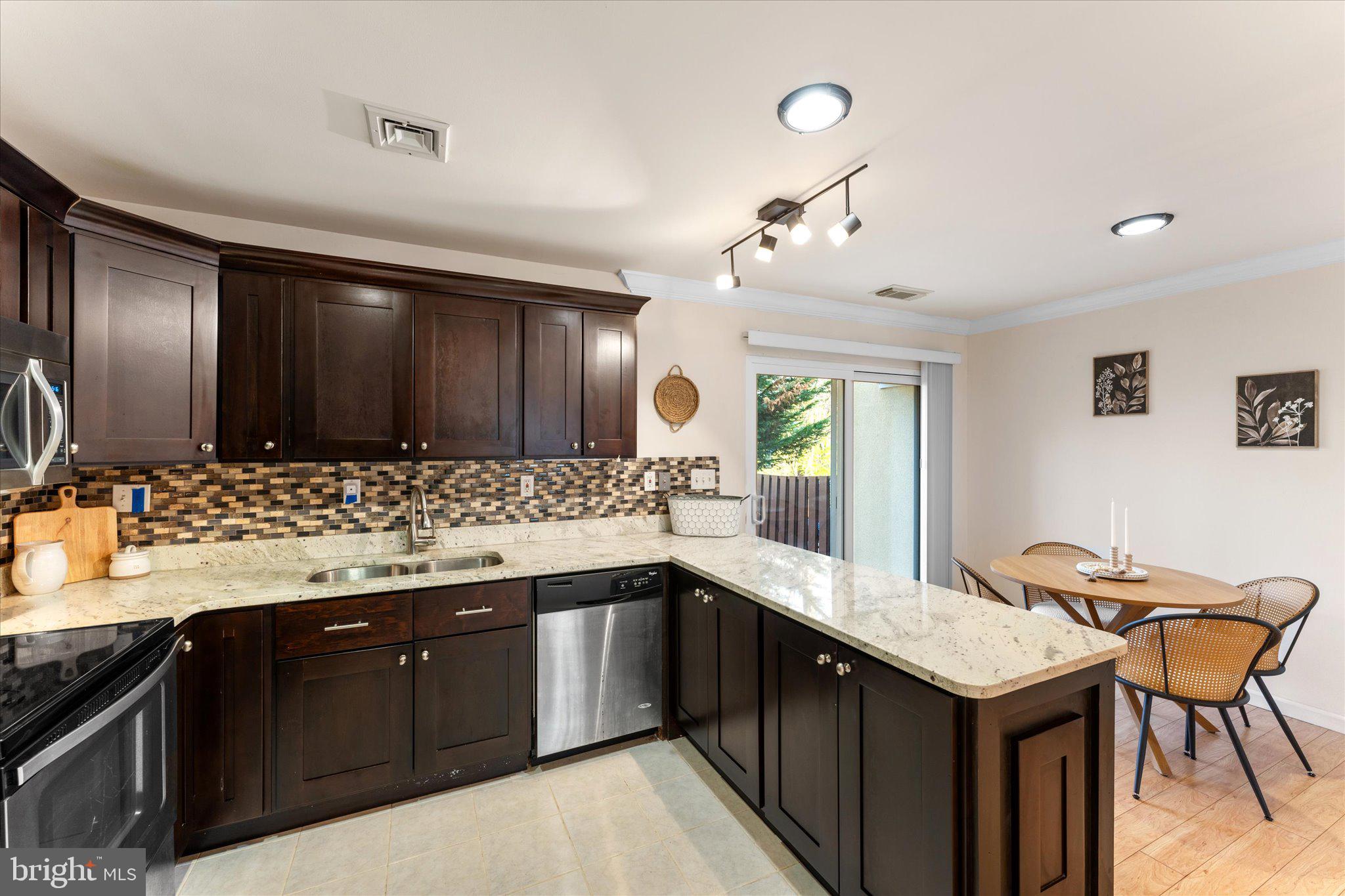 2231 Southgate Square Reston, VA 20191 - Photo 15 of 36 a kitchen with a sink and cabinets
