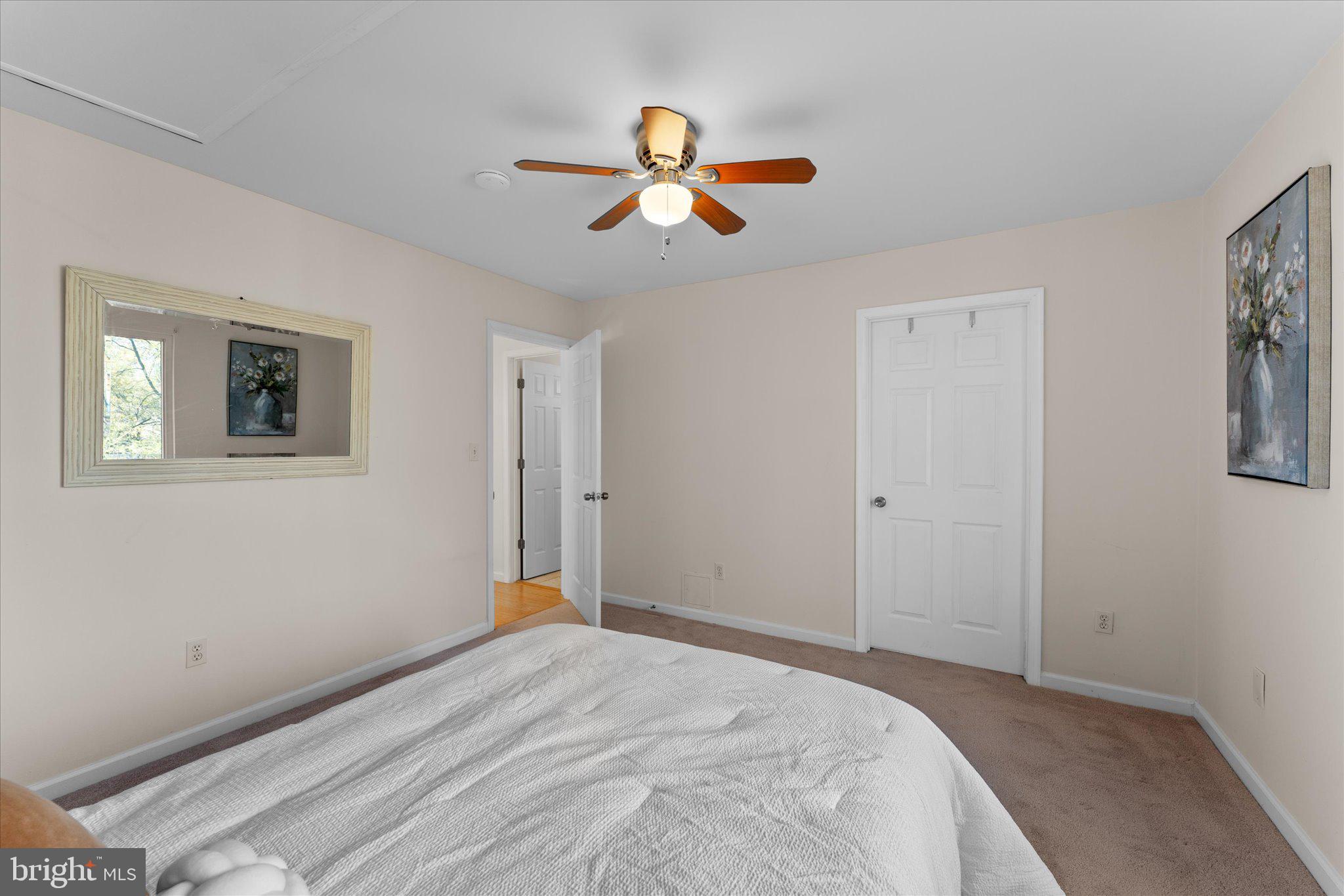 2231 Southgate Square Reston, VA 20191 - Photo 22 of 36 a bedroom with a bed and a chandelier
