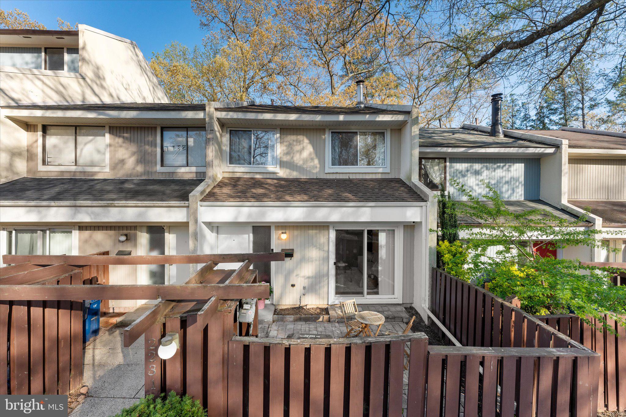 2231 Southgate Square Reston, VA 20191 - Photo 3 of 36 a front view of house with wooden fence