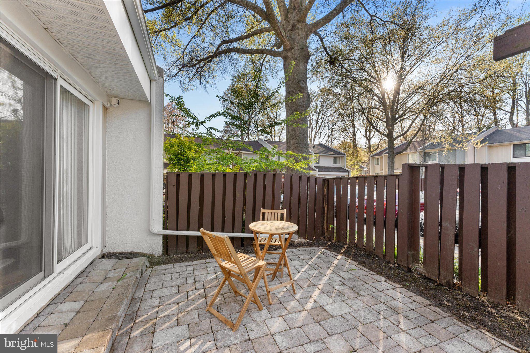 2231 Southgate Square Reston, VA 20191 - Photo 4 of 36 a patio with a table and chairs