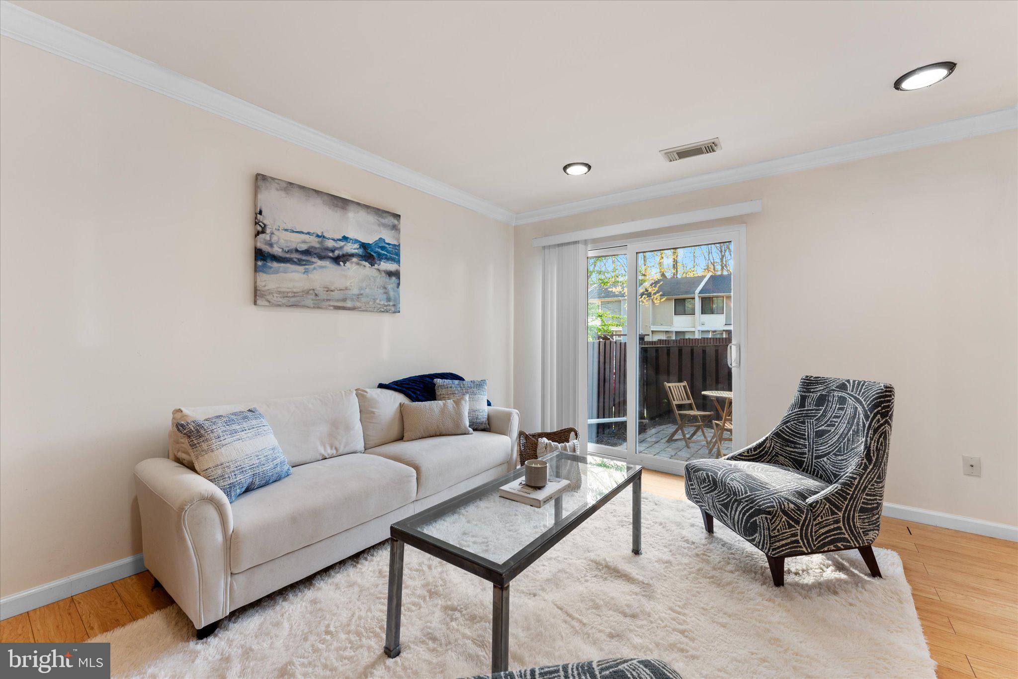 2231 Southgate Square Reston, VA 20191 - Photo 7 of 36 a living room with furniture and a window