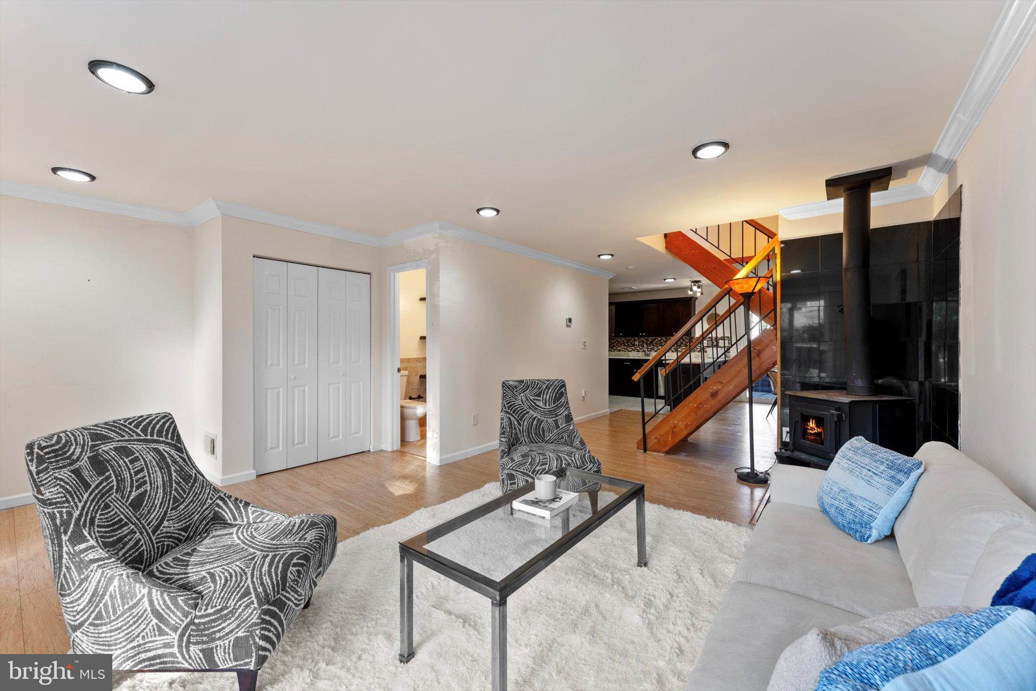 2231 Southgate Square Reston, VA 20191 - Photo 9 of 36 a living room with furniture a rug and white walls