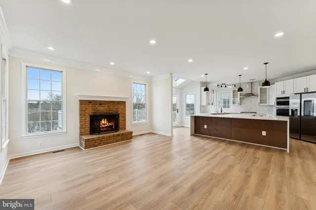 a view of kitchen a sink and a fireplace