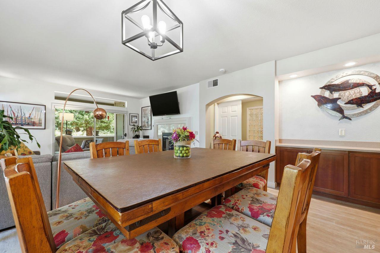 2092 Stonefield Lane Santa Rosa, CA 95403 - Photo 21 of 44 a view of a dining room with furniture window and wooden floor