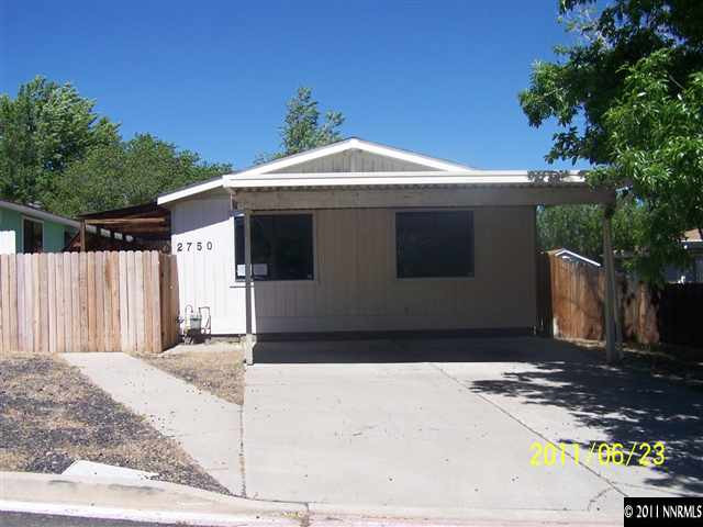 2750 Larkspur Street Reno, NV 89512 - Photo 1 of 12 a front view of a house with a garage