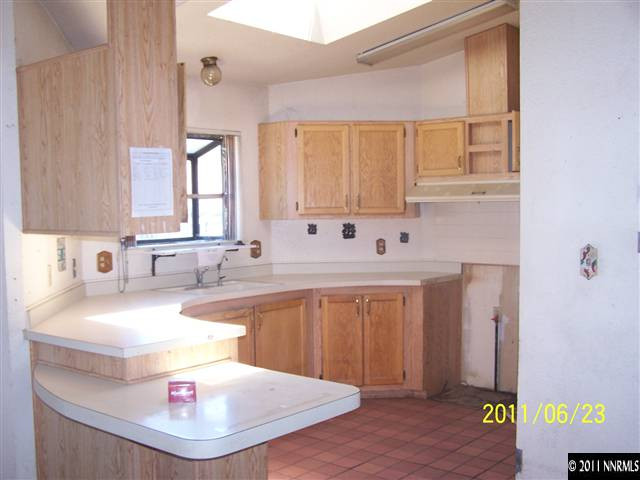 2750 Larkspur Street Reno, NV 89512 - Photo 2 of 12 a bathroom with a sink and a mirror