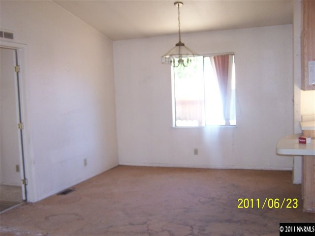2750 Larkspur Street Reno, NV 89512 - Photo 4 of 12 a view of an empty room with a window