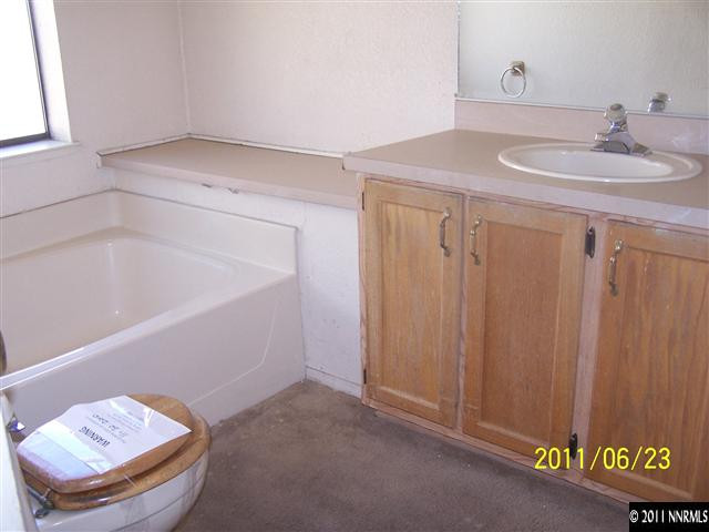 2750 Larkspur Street Reno, NV 89512 - Photo 8 of 12 a bathroom with a sink and a mirror