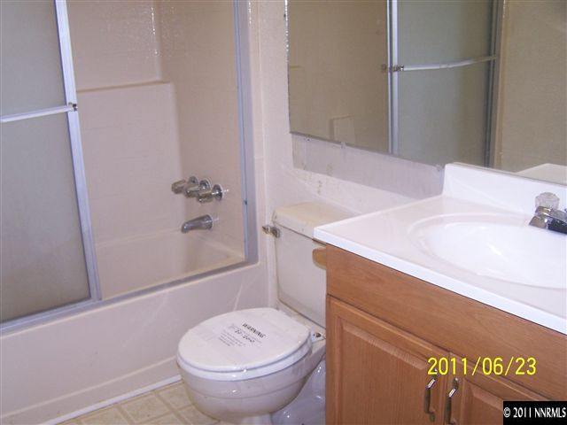 2750 Larkspur Street Reno, NV 89512 - Photo 9 of 12 a bathroom with a sink and toilet