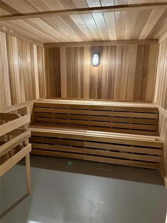 a view of room with stairs and a wooden ceiling fan