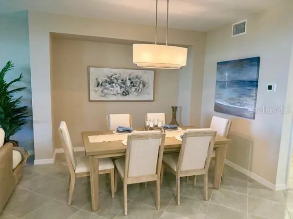a view of a dining room with furniture