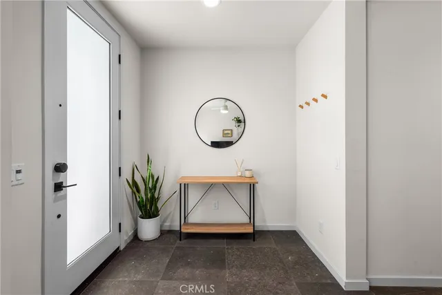 a view of front door with wooden floor