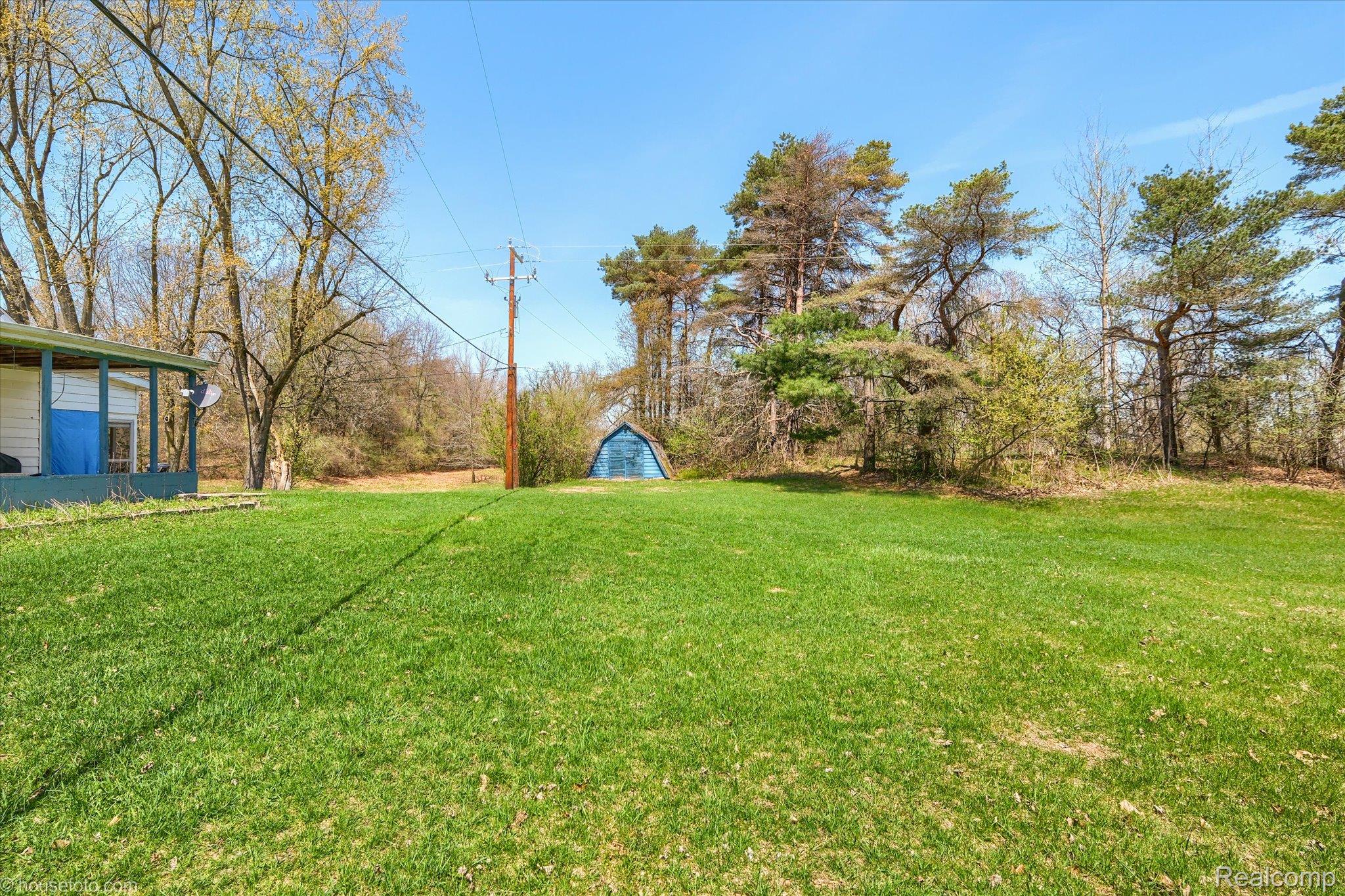 1325 Barnes Lake Road North Branch, MI 48461 - Photo 36 of 42 View of grassy yard featuring an outdoor structure