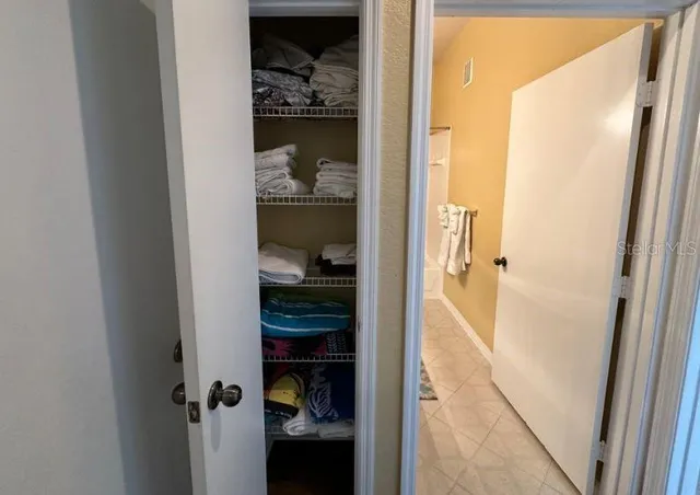 a view of a bedroom from a hallway