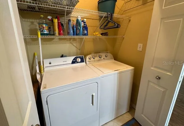 a utility room with dryer and washer