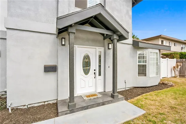 a front view of a house with white door