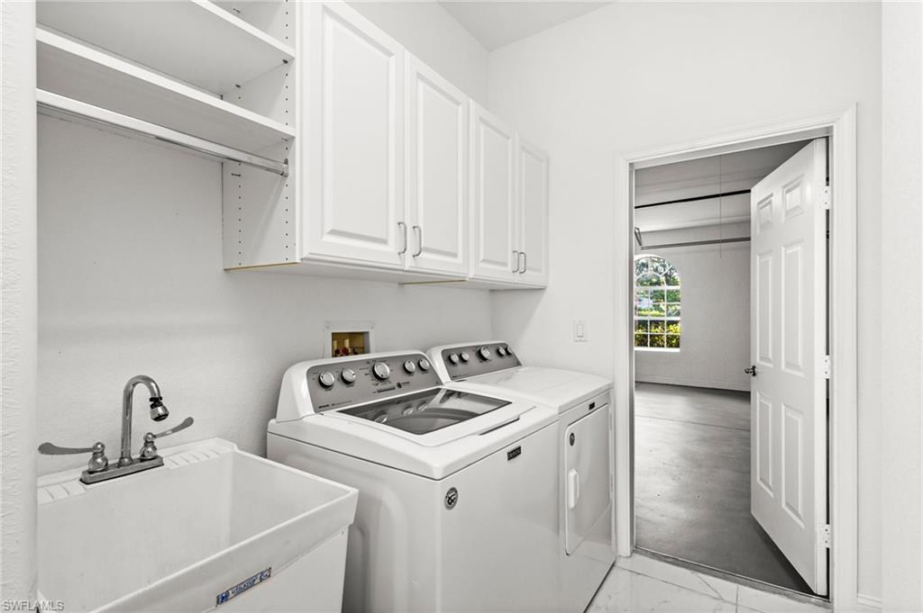 3972 Ruxton Road Naples, FL 34116 - Photo 32 of 41 a kitchen with a sink cabinets and appliances