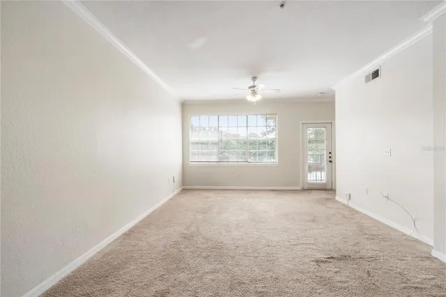 a view of an empty room with a window