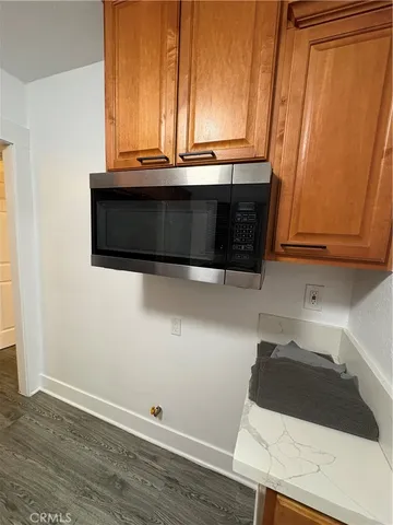 a bathroom with a sink and a microwave