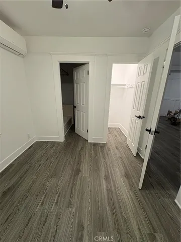 a view of a room with wooden floor and stairs