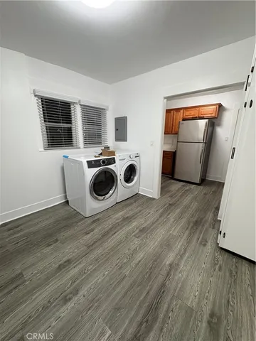a view of kitchen and wooden floor