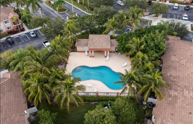 an aerial view of a house with a garden