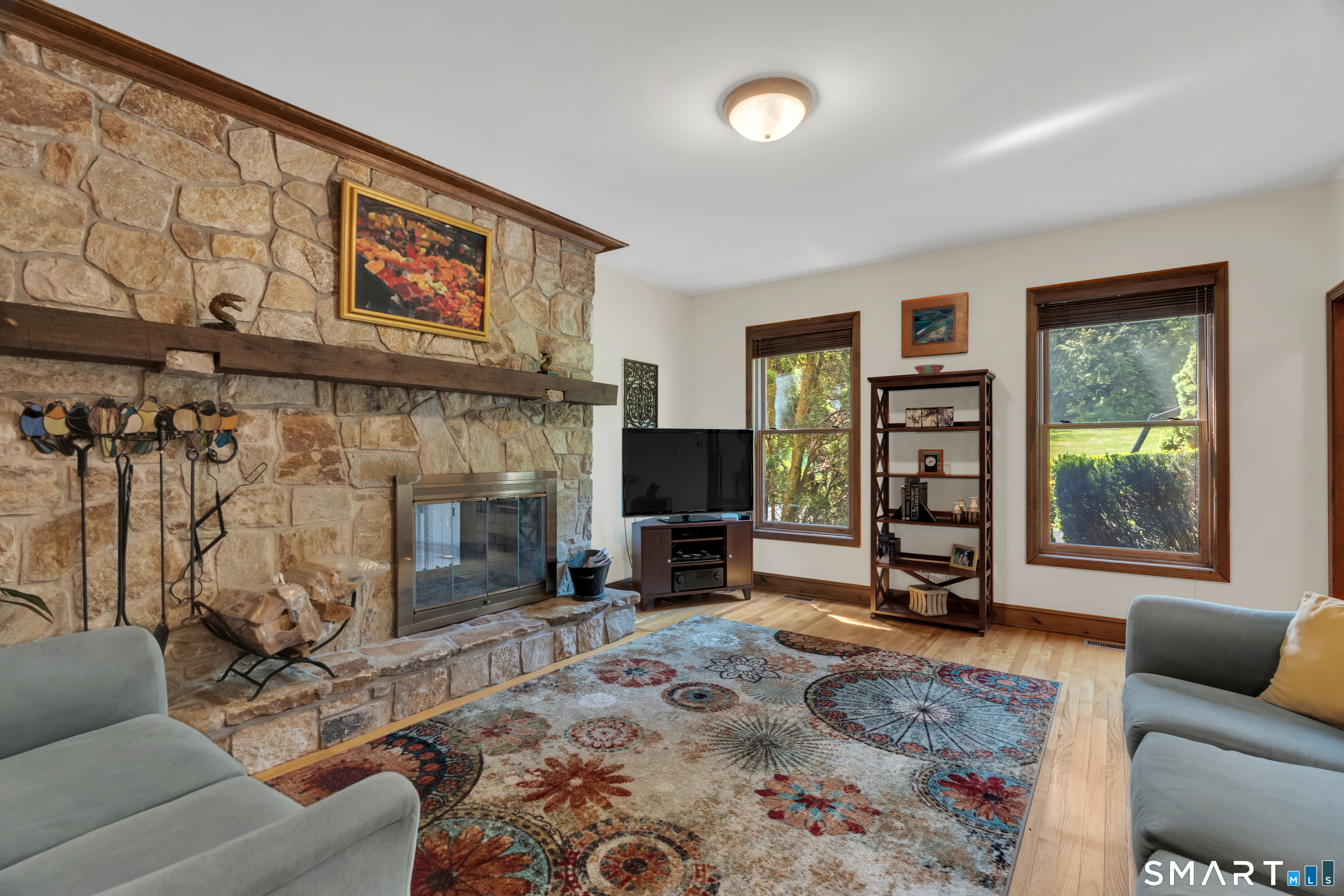 194 Quaker Farms Road Oxford, CT 06478 - Photo 11 of 40 a living room with furniture and a fireplace