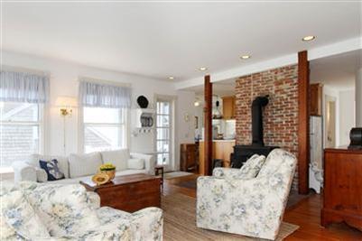 8 Cliff Road, Unit C Nantucket, MA 02554 - Photo 3 of 12 a bedroom with furniture and a large window