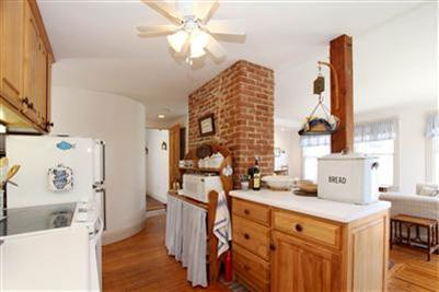 8 Cliff Road, Unit C Nantucket, MA 02554 - Photo 5 of 12 a bathroom with a sink a vanity and a mirror