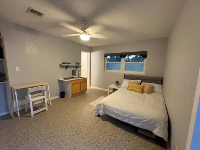 a bedroom with a bed and a cabinets