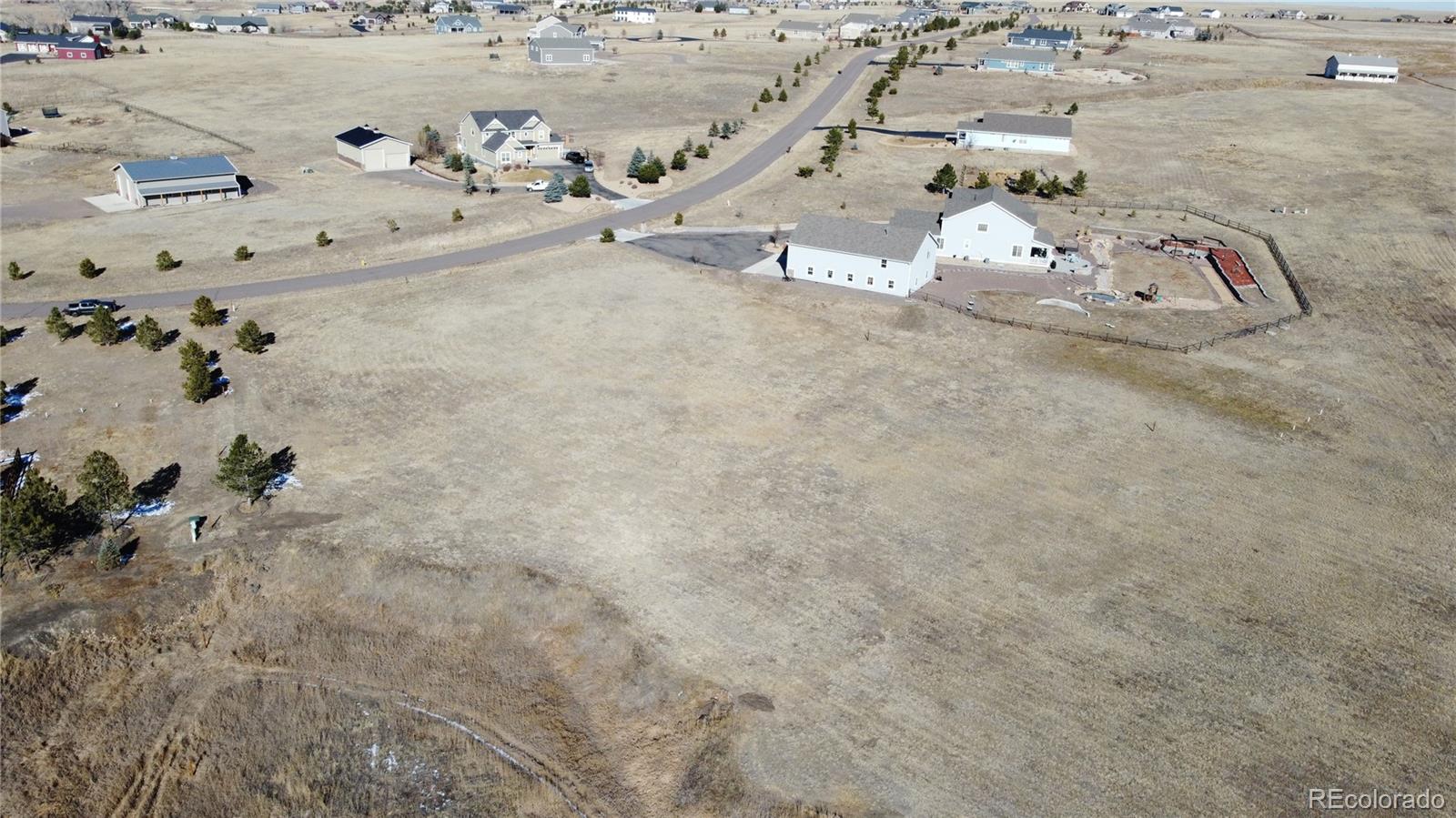 3131 Antelope Ridge Trail Parker, CO 80138 - Photo 3 of 13 a bed with white sheets and pillows on it
