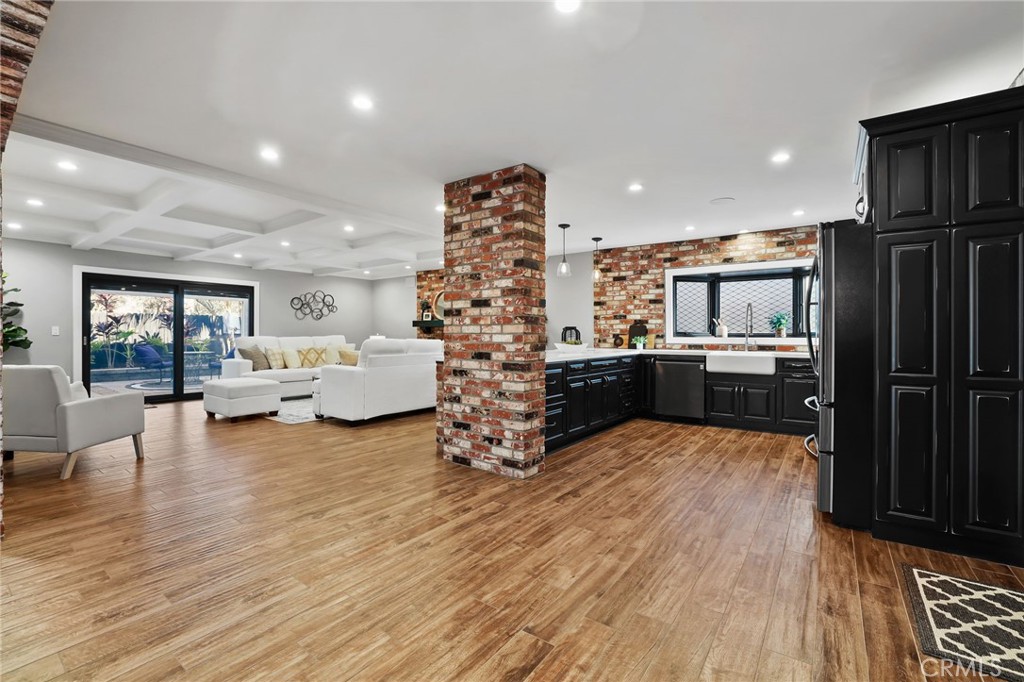 1810 Tanager Drive Costa Mesa, CA 92626 - Photo 12 of 55 a living room with furniture and kitchen view